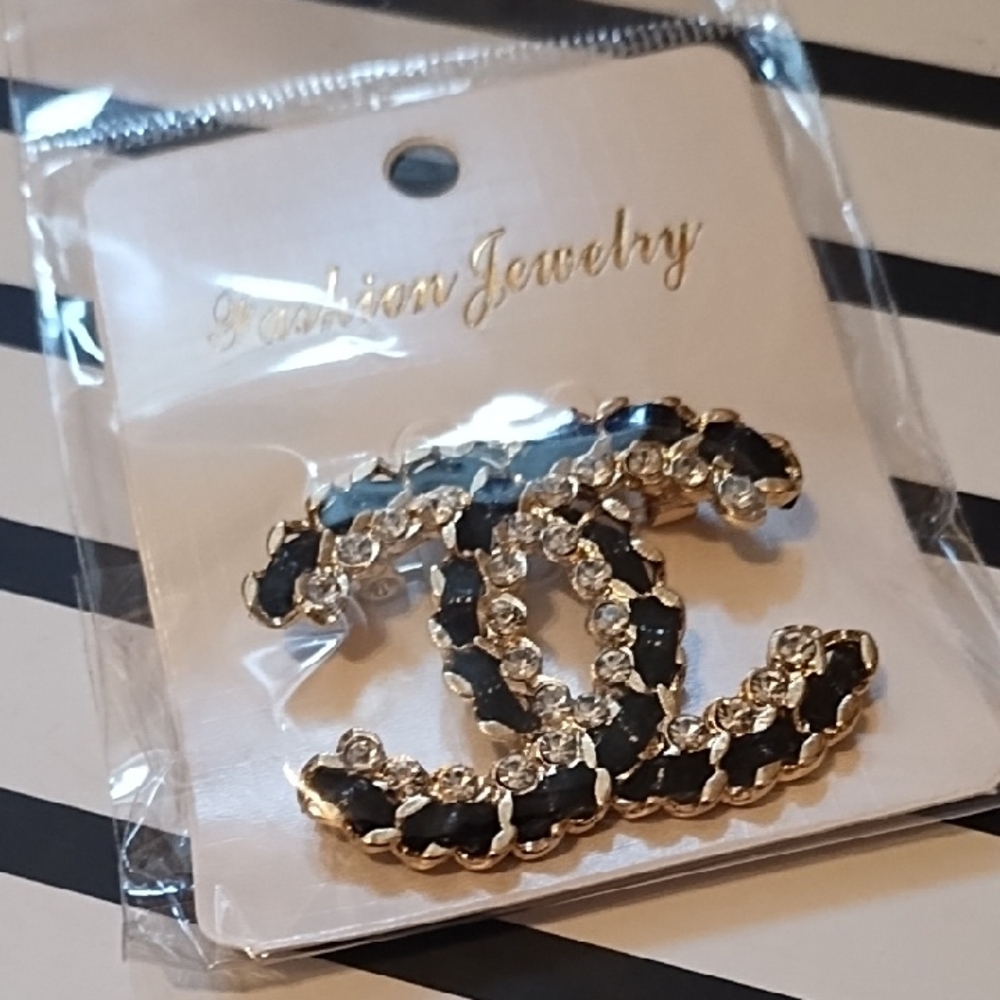 Elegant Black and Gold Brooch